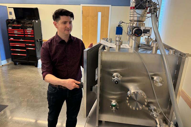 Bennett Maruca with his new thermal vacuum chamber